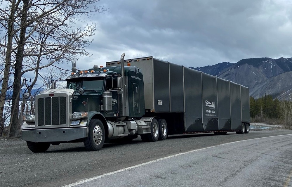 Semi truck hauls load in Alaska critical dedicated lane management